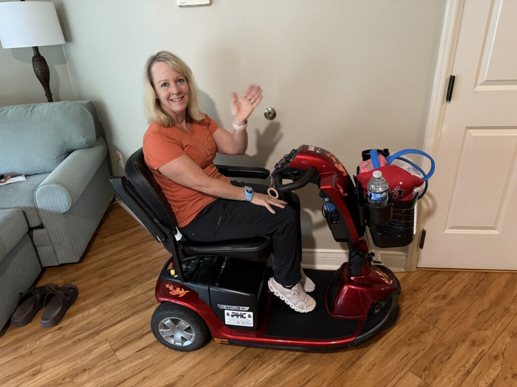 Mobility scooters at Disney World. Nancy on her mobility scooter inside a Disney resort room at Old Key West, relaxed and ready for the day.